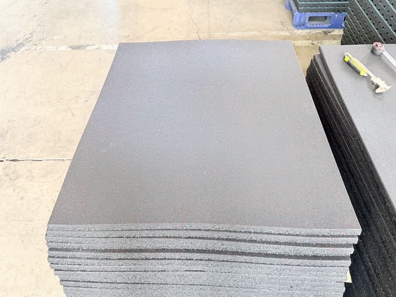 industrial chic group fitness studio with blue rubber flooring